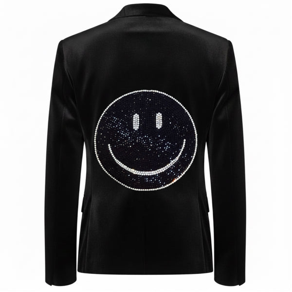 Back view of a black velvet blazer with a dark rhinestone smiley face outlined in silver crystals.