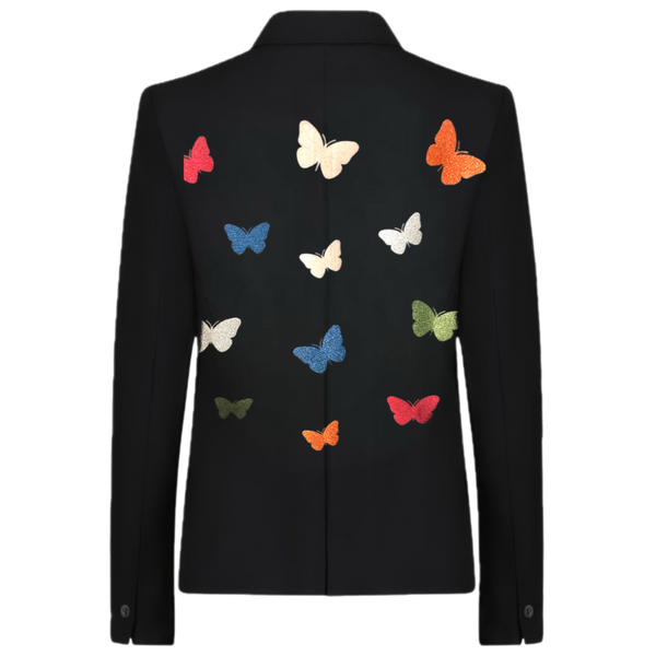 Back view of a black blazer with colorful butterfly designs scattered across the back.