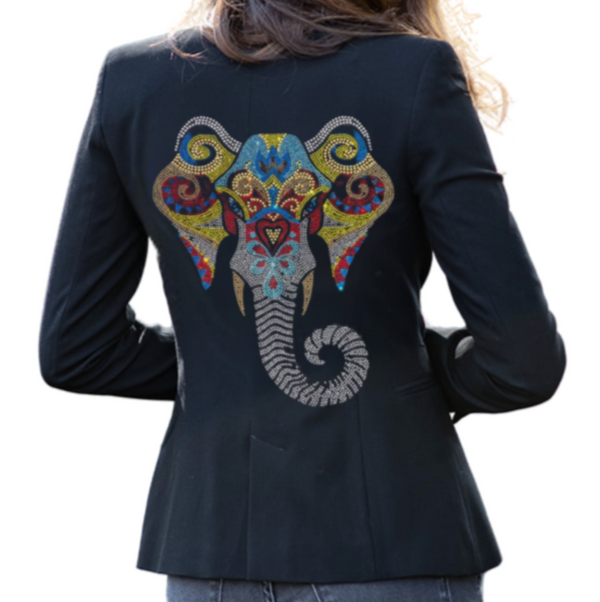 Woman showing a colorful rhinestone elephant head on the back of a dark blazer.