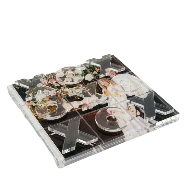 Clear acrylic tray with decorative elements on a white background