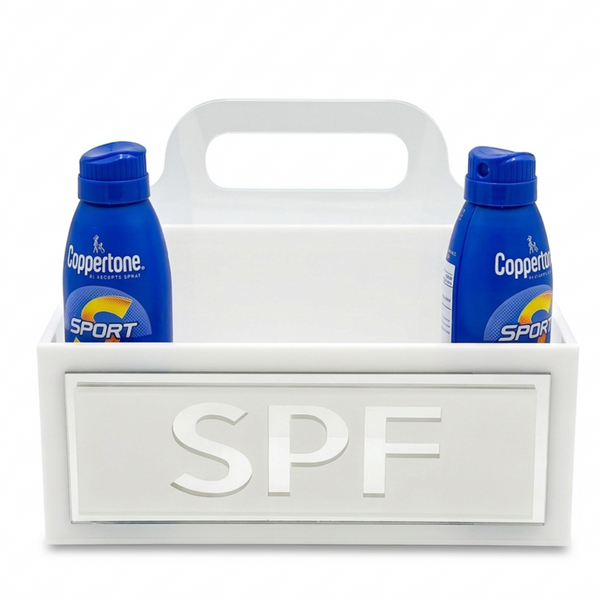 Two bottles of Coppertone Sport sunscreen in a white carrying case with 'SPF' on a white background.