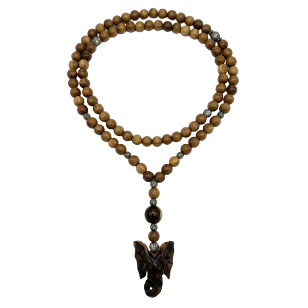 A beaded necklace made of round brown wooden beads with a carved dark brown winged pendant, accented by small silver-toned spacers, shown on a plain white background.