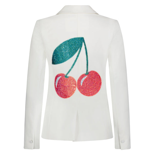 Back view of a white denim blazer with red rhinestone cherries and green stems and leaf.