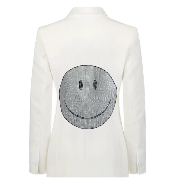 Back view of a white denim blazer with a large silver rhinestone smiley face.