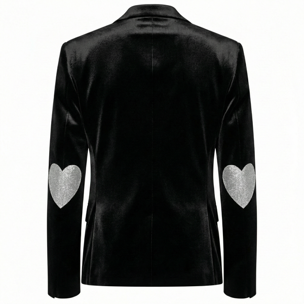 Back view of a black velvet blazer with a silver heart design on each elbow.