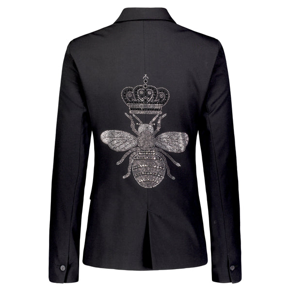 Back view of a black blazer with a large silver rhinestone bee topped with a crown.