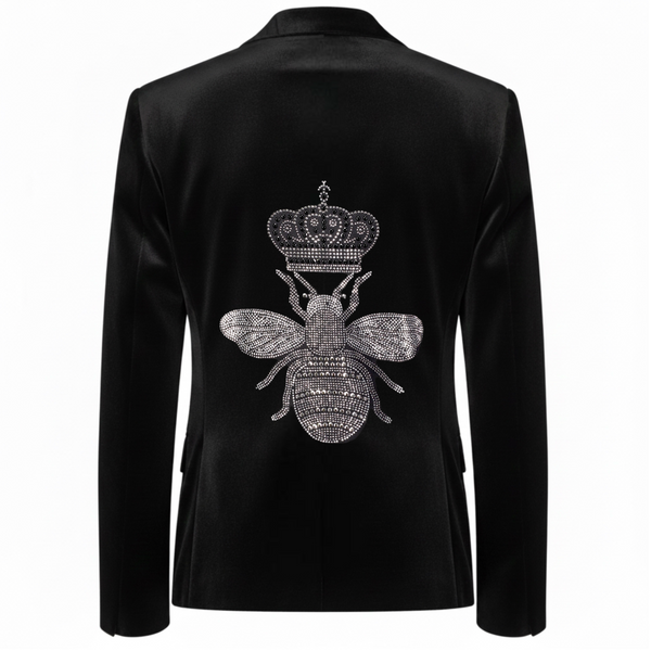 Back view of a black velvet blazer with a large silver rhinestone bee topped with a crown.