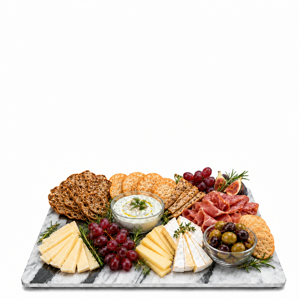 Three clear glass straws stand upright on a white marble tray, each holding one or two small golden-brown donuts. Two clear glass bowls sit on the tray against a plain white background.