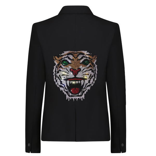 Back view of a black blazer with a rhinestone tiger face and green eyes.